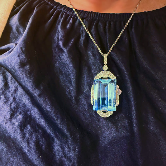 An Art Deco large rectangular aquamarine and diamond pendant in platinum