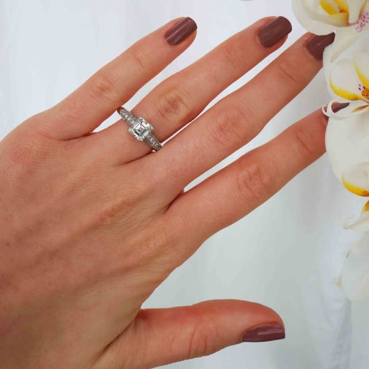 Emerald Cut Diamond and Platinum Ring With Pavé Set Shoulders, 1.23ct