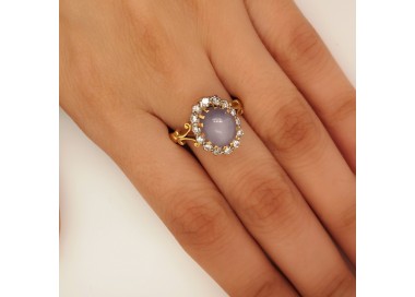 Star Sapphire and Diamond Cluster Ring modelled on finger