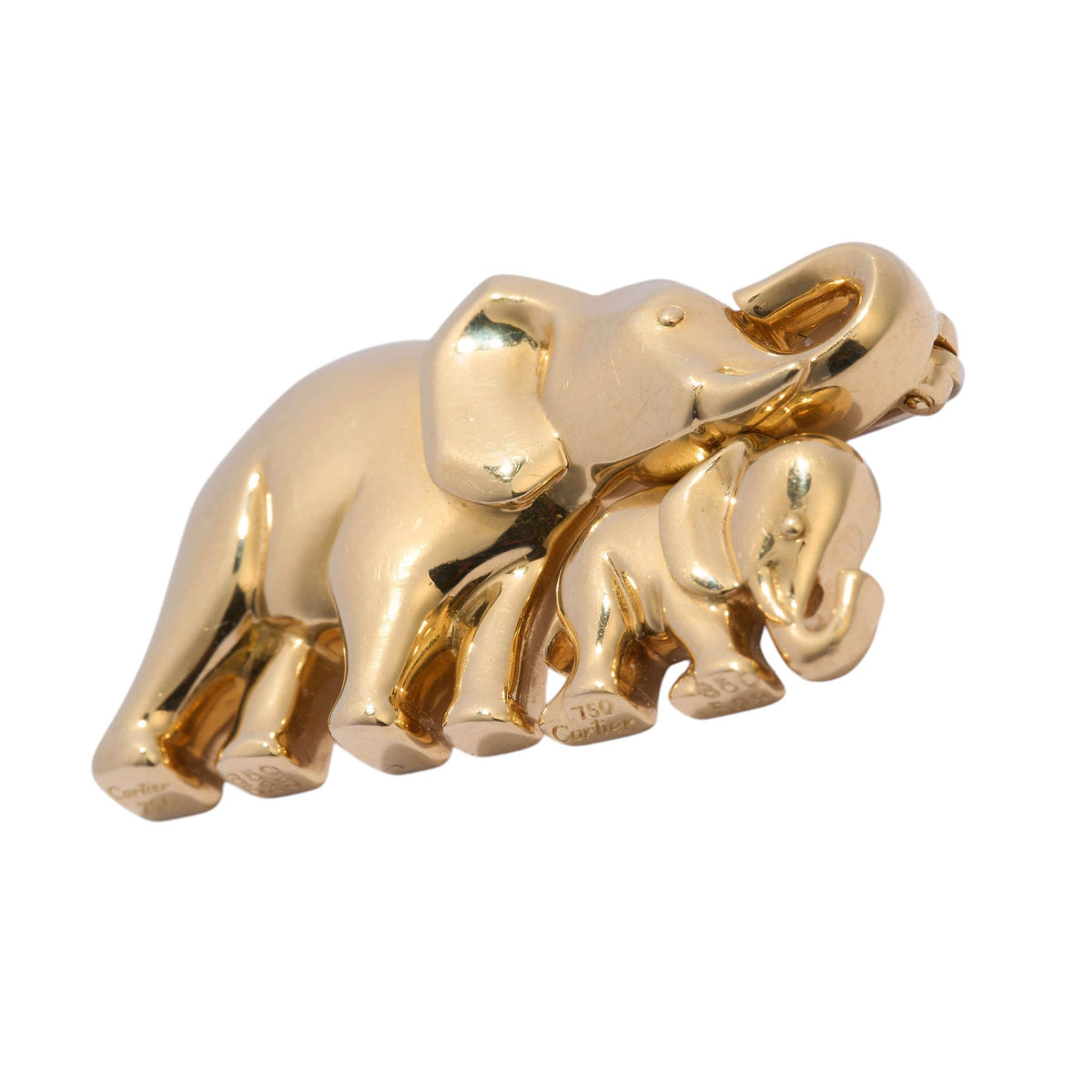 A vintage Cartier 18ct yellow gold, mother and calf elephant brooch, featuring two stylised, geometric, dome shaped elephants, with the calf closely coupled to the mother, on a shepherd's hook. The can be worn as a separate pendant, signed Cartier.