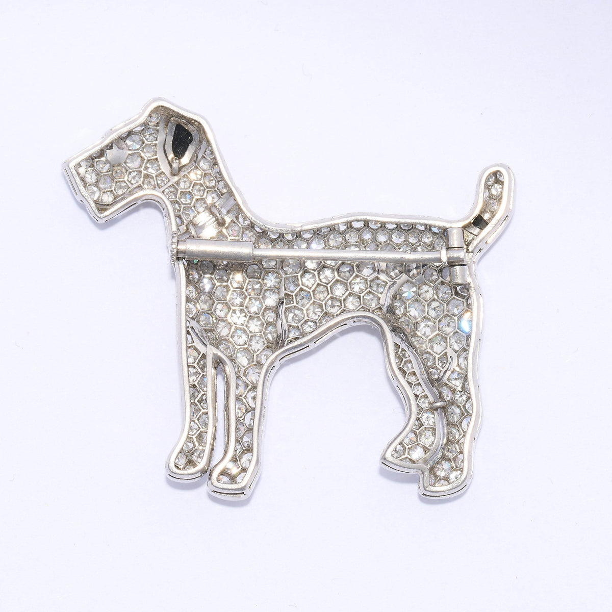 A diamond set terrier dog brooch with black onyx details, in platinum