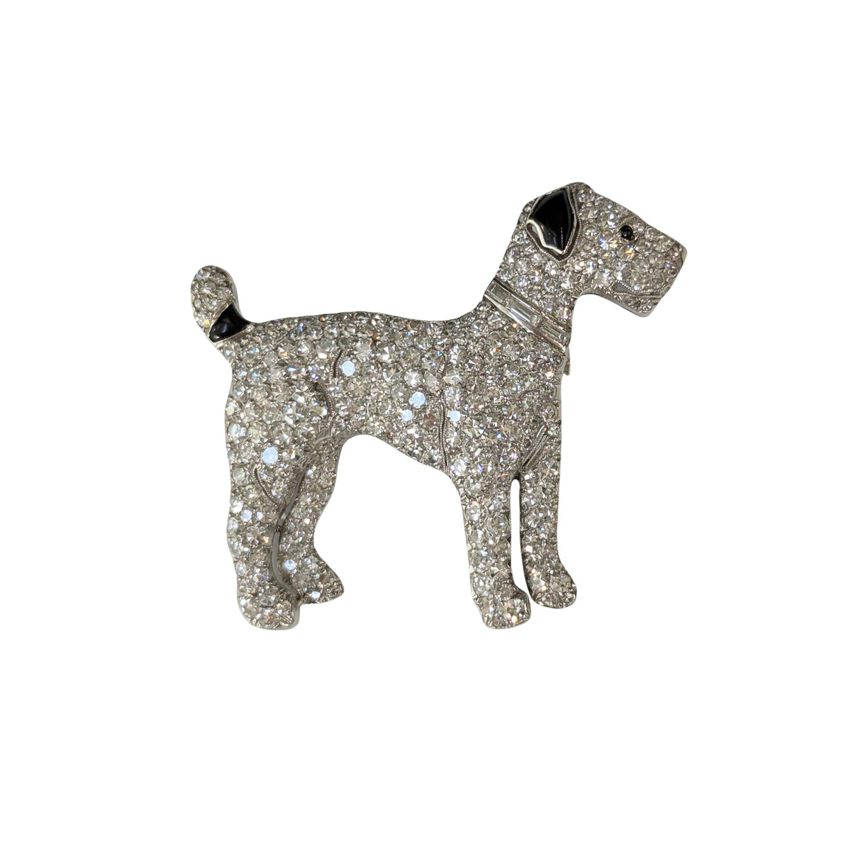 A diamond set terrier dog brooch with black onyx details, in platinum