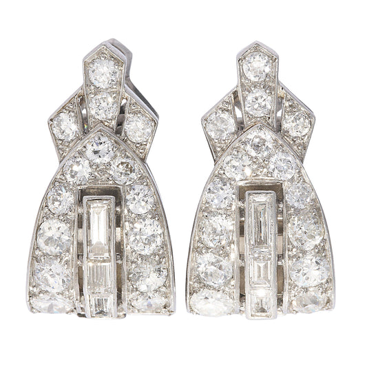 A pair of platinum clips set with round and baguette cut diamonds