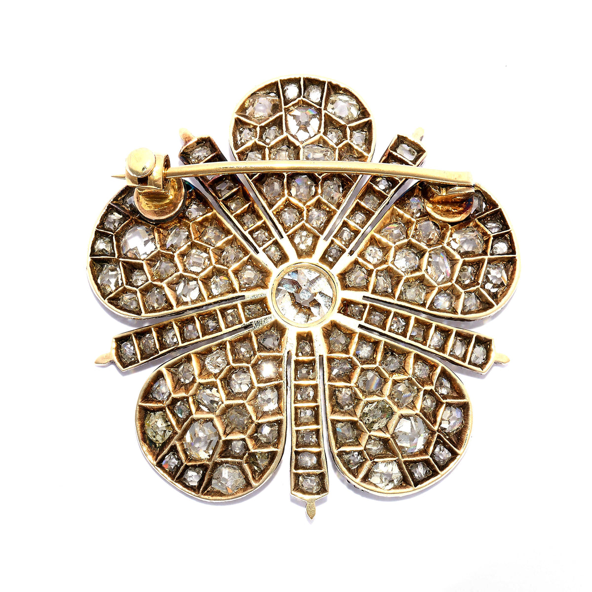 An antique old cut diamond flower brooch in silver and gold