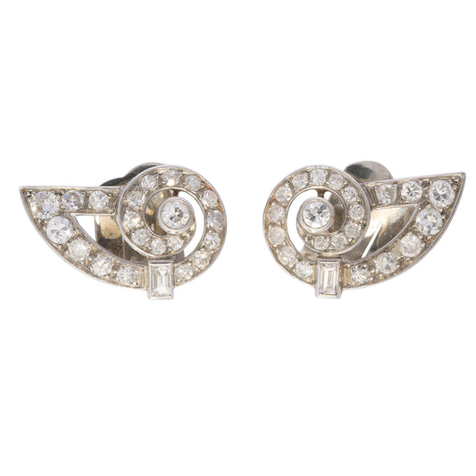 A pair of round diamond shell shaped earrings in platinum