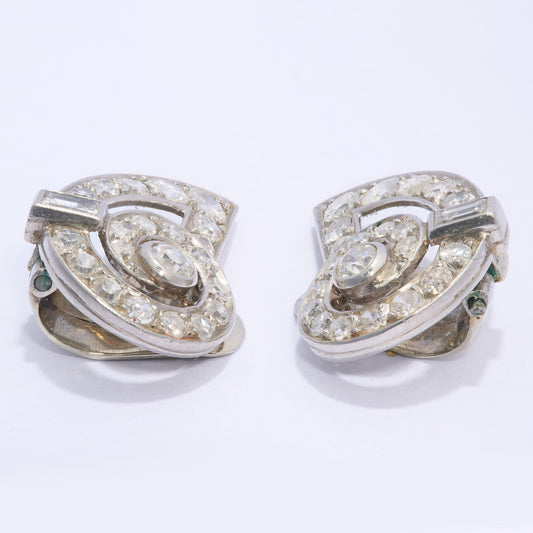A pair of round diamond shell shaped earrings in platinum