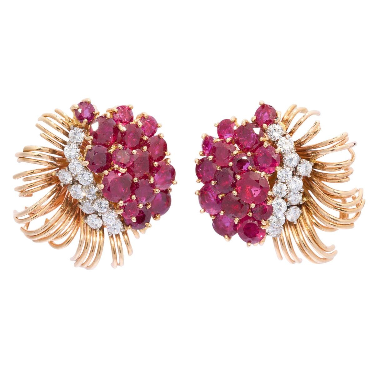 A pair of round ruby and round diamond floral spray earrings in yellow gold