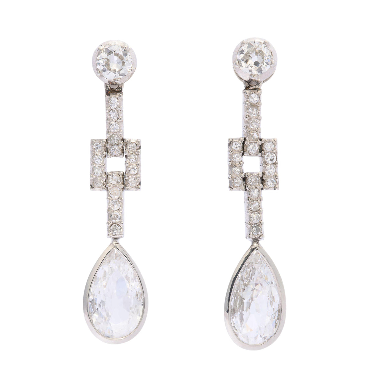 A pair of old cut and pear cut diamond drop earrings in platinum