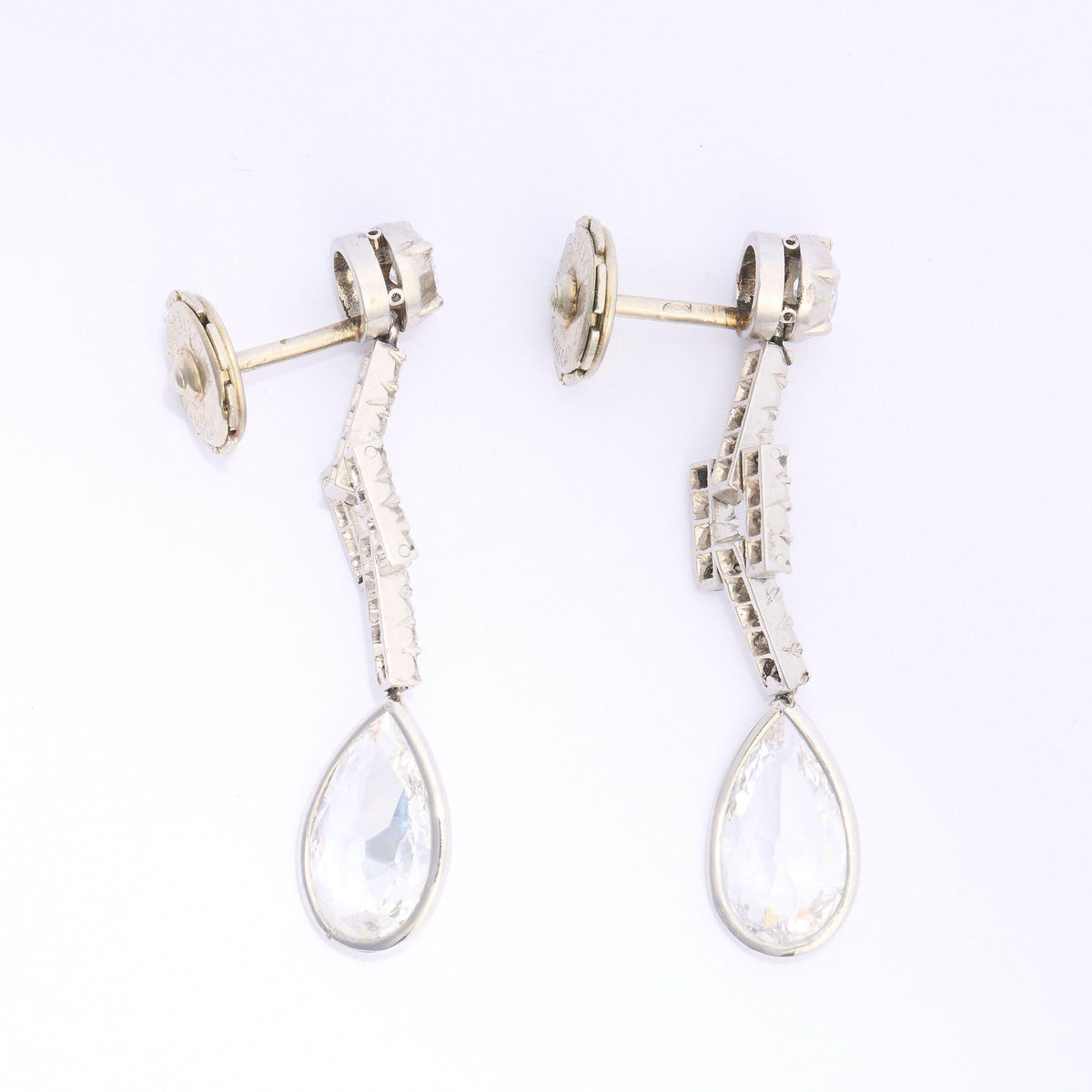 A pair of old cut and pear cut diamond drop earrings in platinum