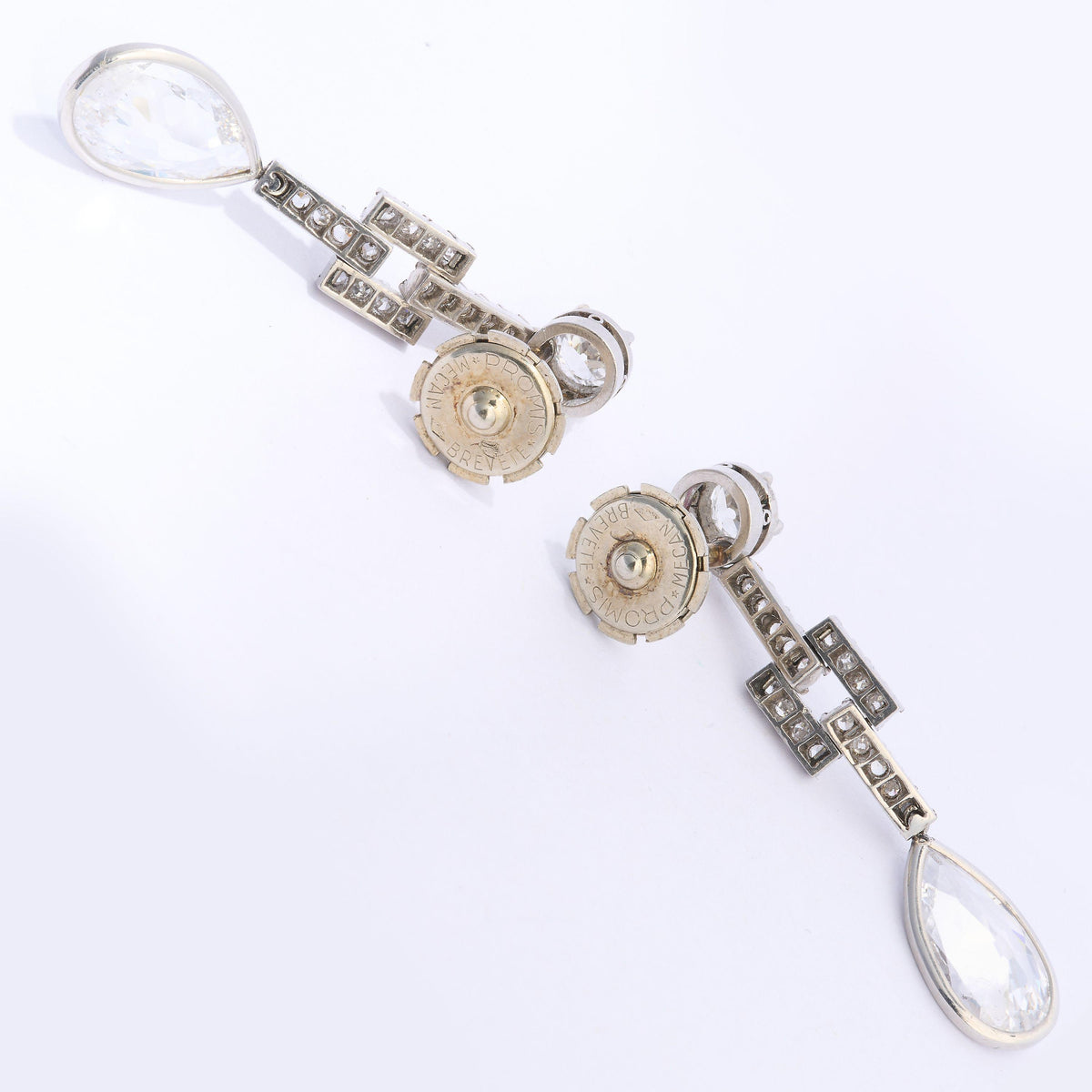 A pair of old cut and pear cut diamond drop earrings in platinum