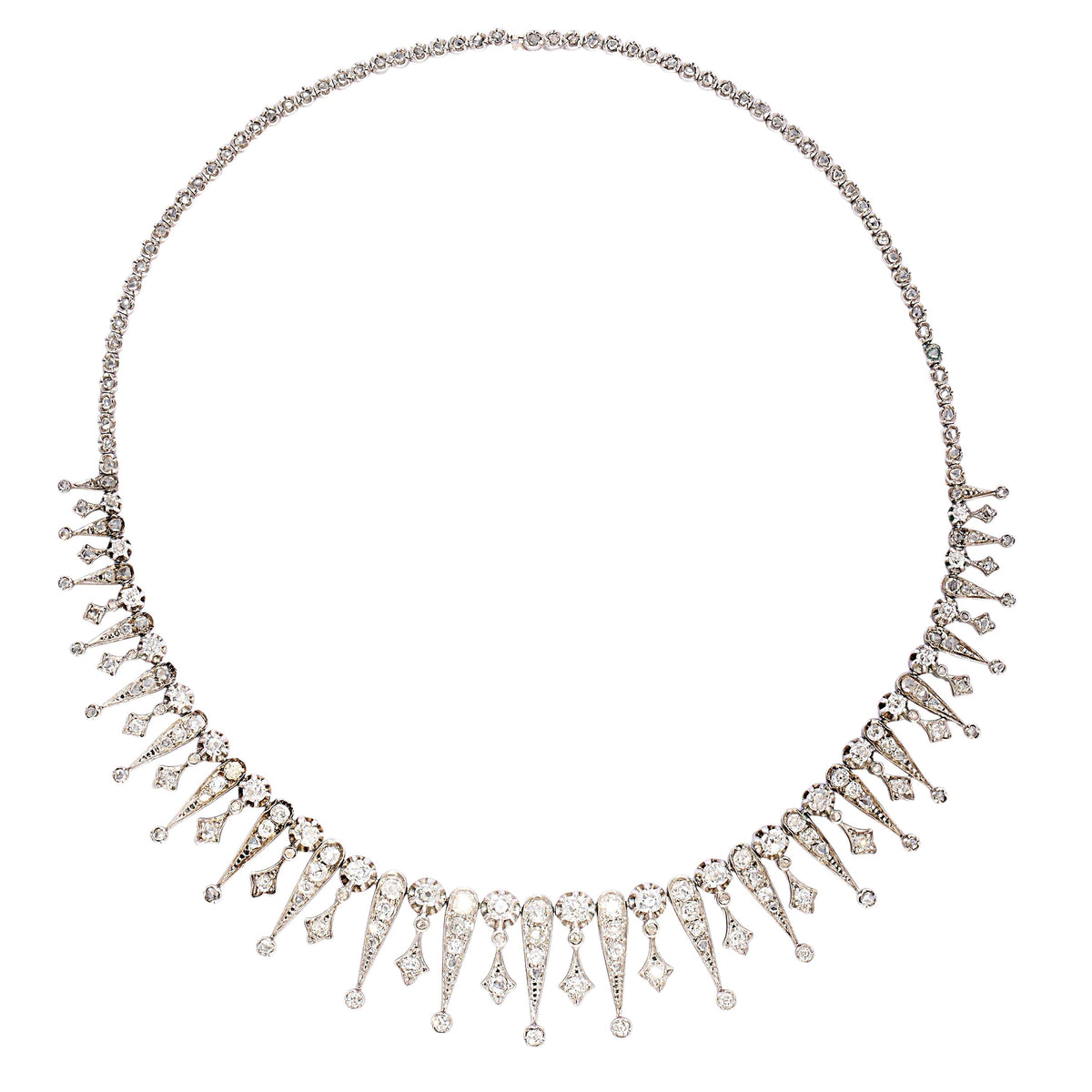 A French, antique, diamond drop necklace, featuring a graduating, old mine-cut diamond set fringe, of alternating, claw set diamond topped, grain set trefoils and reverse teardrops, with round, old mine-cut diamonds below, in pinched, trefoil settings, onto a backchain set with rose-cut diamonds, in pinched, trefoil settings, mounted in silver-upon-gold, with two boars' heads marks for silver, with a sideways fitting, box and tongue clasp