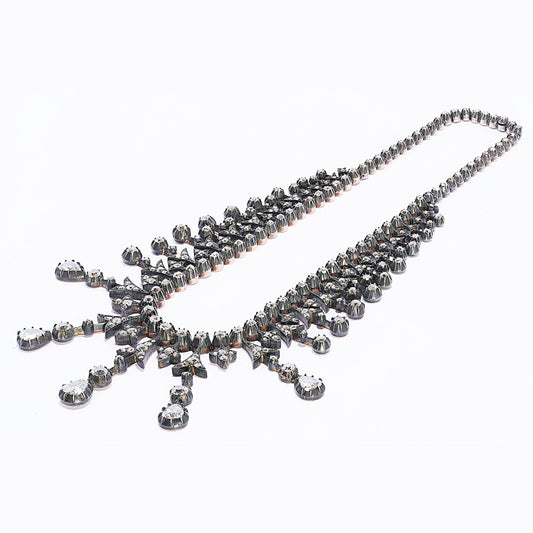 An antique French diamond fringe drop tiara necklace, featuring a graduating fringe of alternating, old mine-cut diamond, grain set, trefoils and arrowheads, with round, old mine-cut diamonds below, in cut down settings, mounted on knife edges, with the centre five drops terminating with pear shaped diamonds, onto a backchain set with rose cut diamonds, in cut down settings, mounted in silver-upon-gold, with a gold box and tongue clasp, with French eagle head marks for 18ct gold, circa 1860. Estimated total