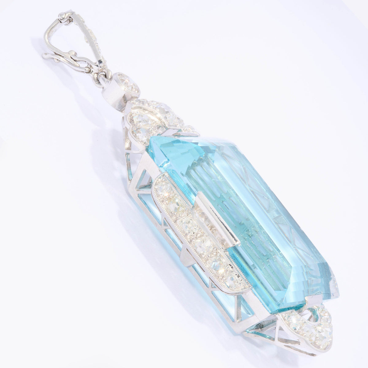 An Art Deco large rectangular aquamarine and diamond pendant in platinum