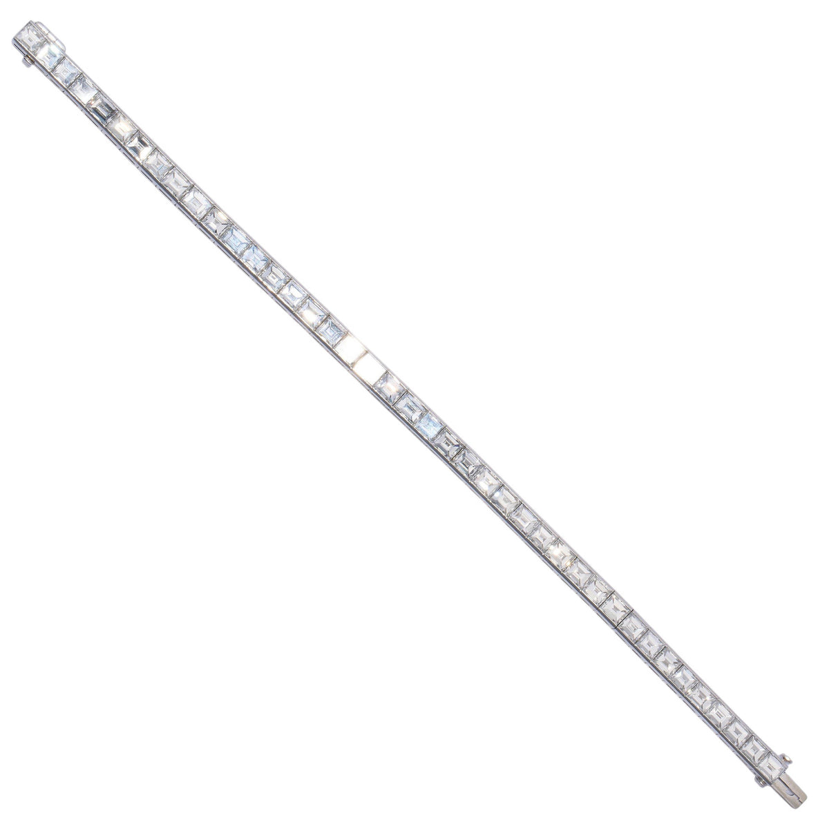 A square cut diamond channel set line bracelet in platinum