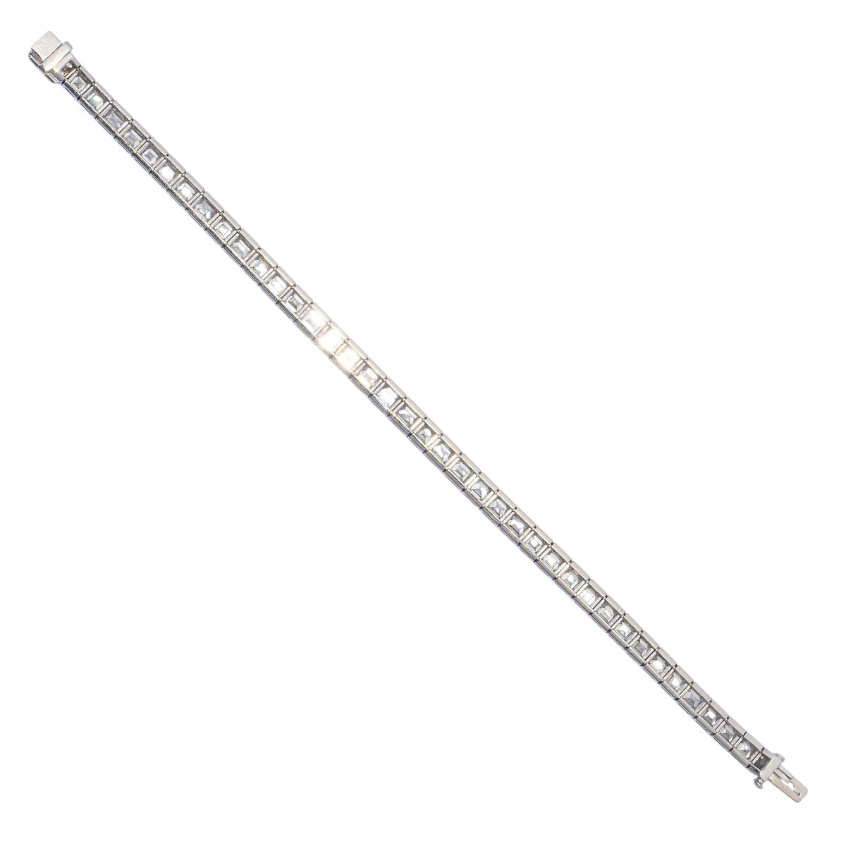 A square cut diamond channel set line bracelet in platinum