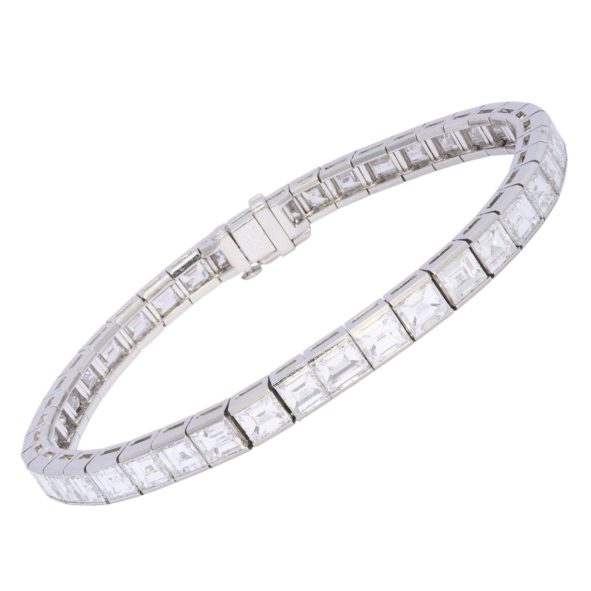 A square cut diamond channel set line bracelet in platinum