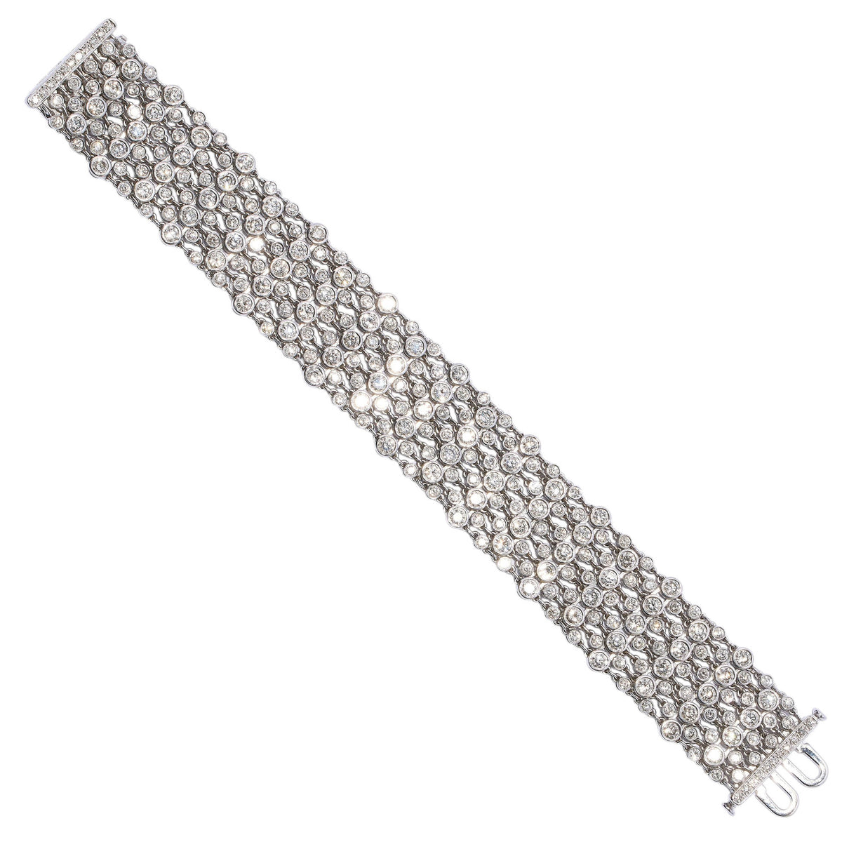 A wide multi-row bracelet set with brilliant cut diamonds in white gold