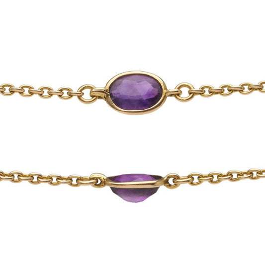 A long yellow gold chain necklace with oval amethysts