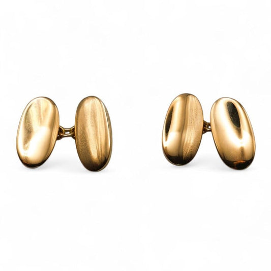 A pair of oval plain yellow gold cufflinks