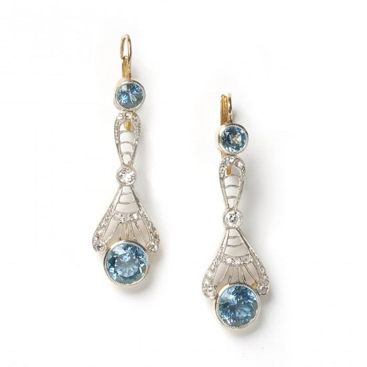 A pair of aquamarine and diamond openwork drop earrings in silver and yellow gold