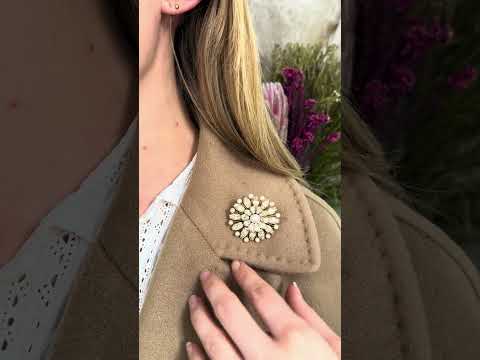 Video of a decorative pearl and diamond flower brooch/pendant in yellow gold