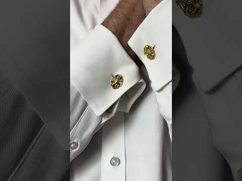 Video of a pair of oval yellow gold cufflinks with dragon motifs